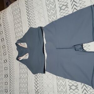 NWOT Fabletics outfit, size small. Blue and colorful decorative straps on back.